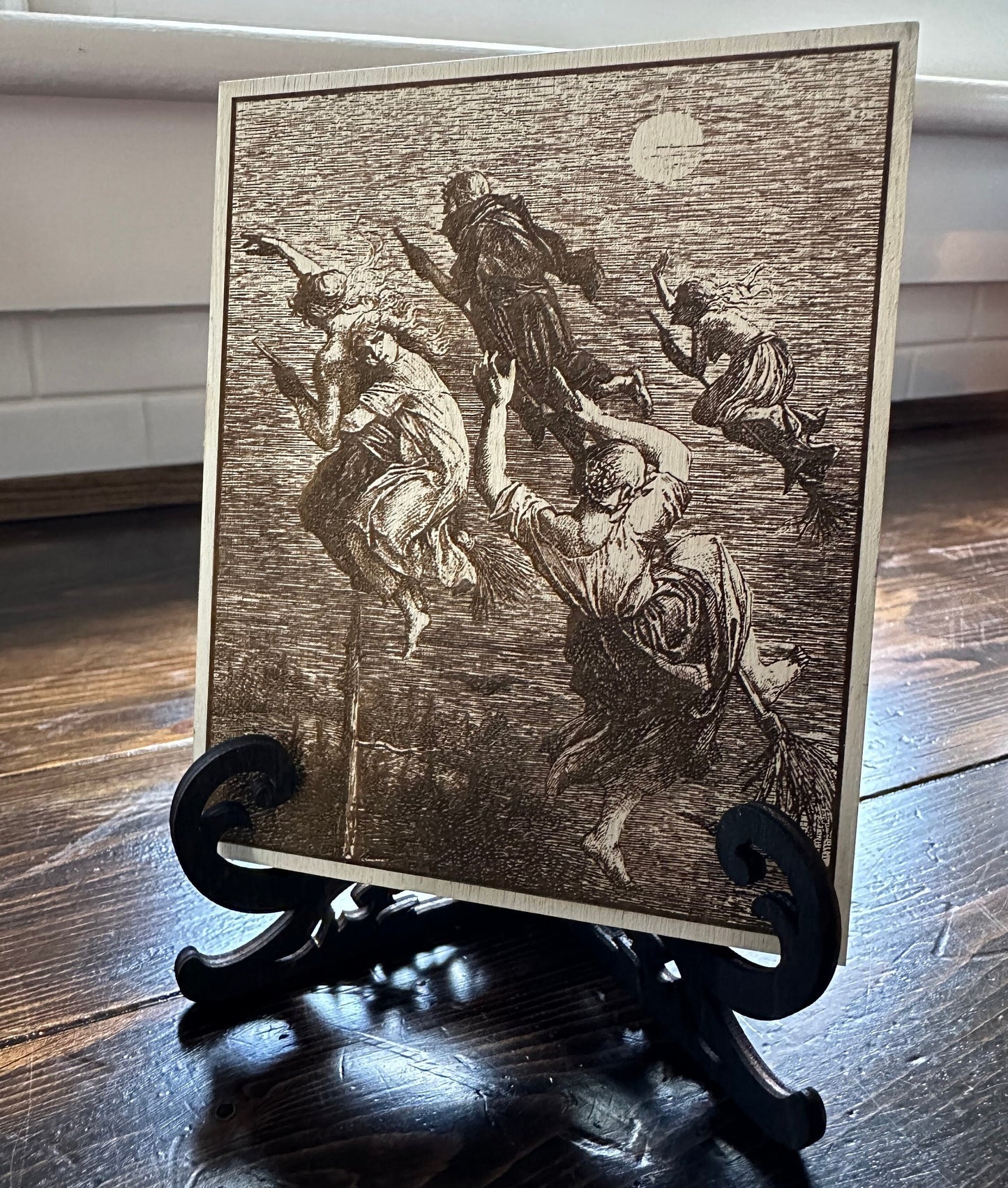 Witches flying engraved plaque.