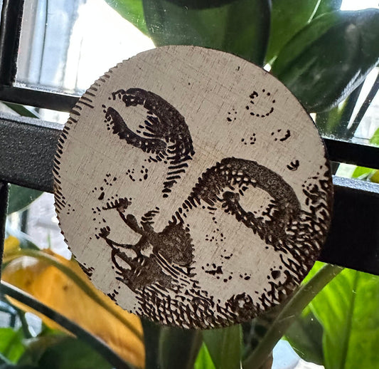 Mini sleepy moon face engraved magnet.